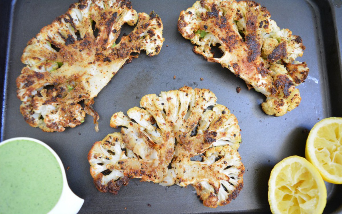 Spice-Rubbed Roasted Cauliflower With Spinach Tahini Sauce