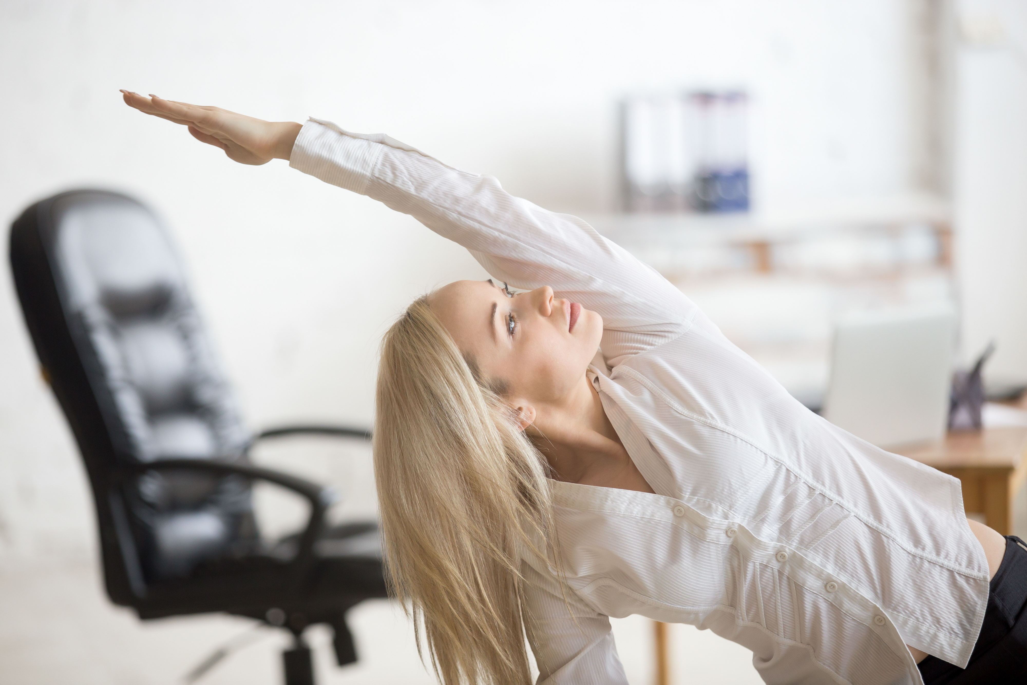 Woman stretching at work