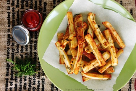 Fries on a green plate with dipping sauces