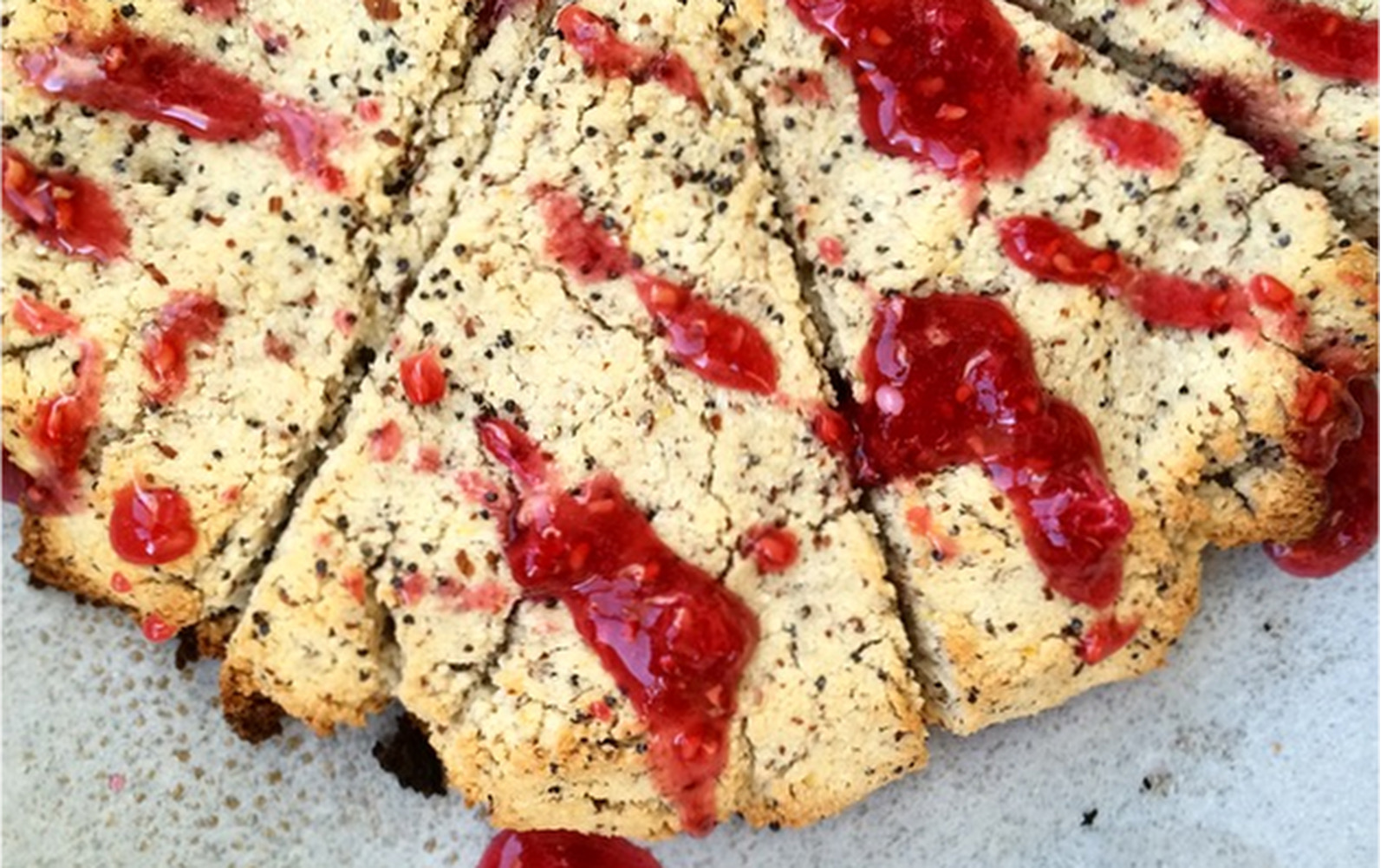 Lemon and poppy seed scones with a raspberry and lavender glaze