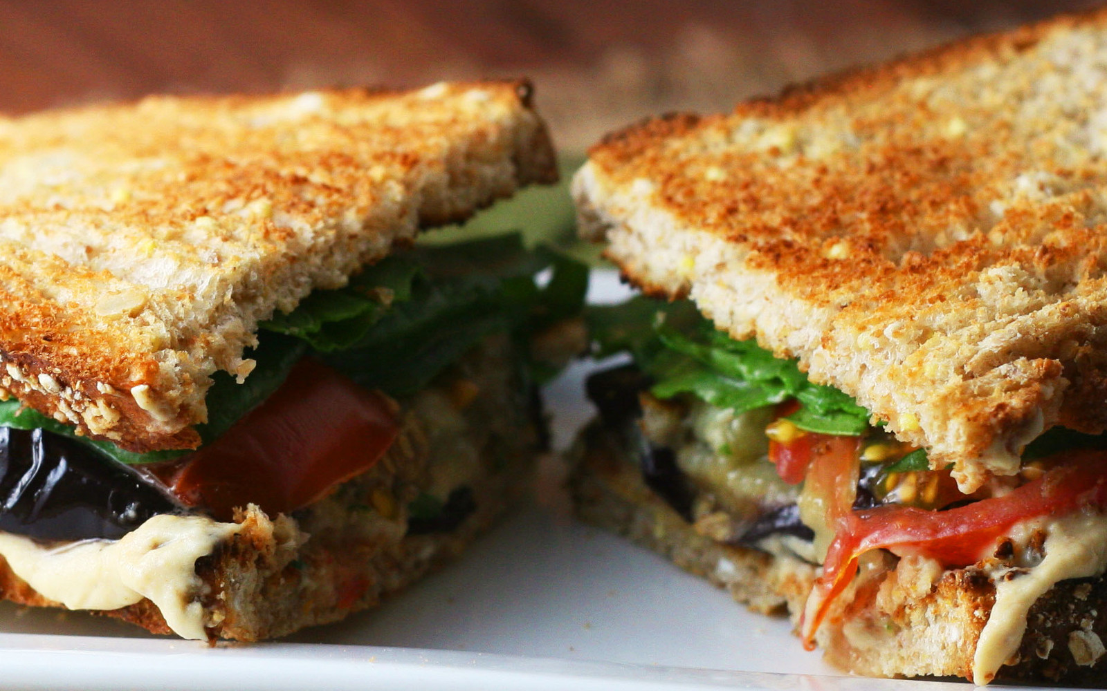 Sandwich with roasted eggplant and marinated tomatoes