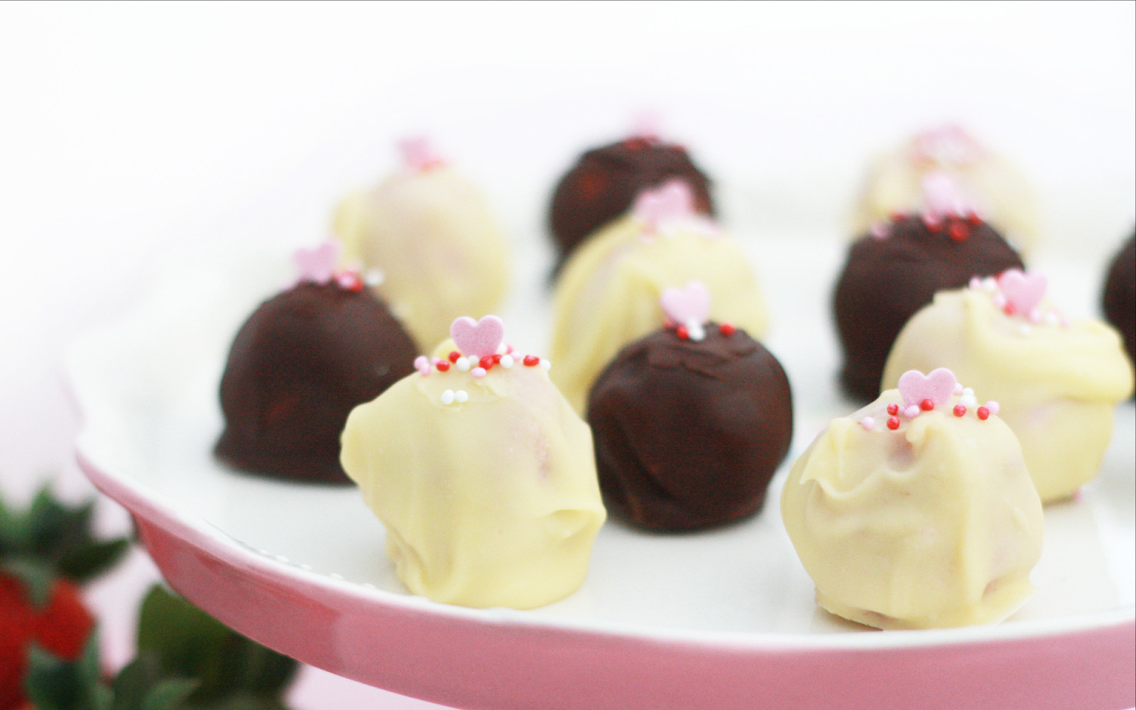 Strawberry and coconut truffle with a chocolate coating