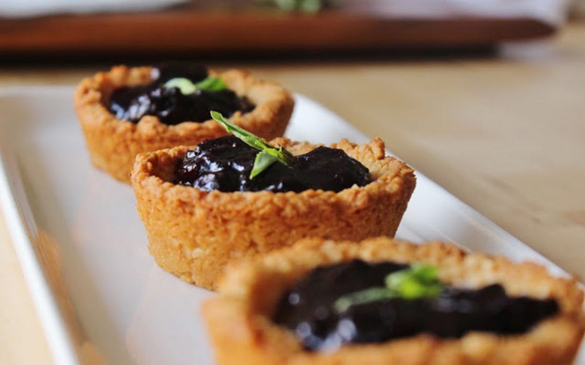 Lemon and macaroon cups with blueberry and basil compote