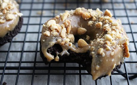 Vegan Chocolate Doughnuts With Peanut Butter Glaze with nuts