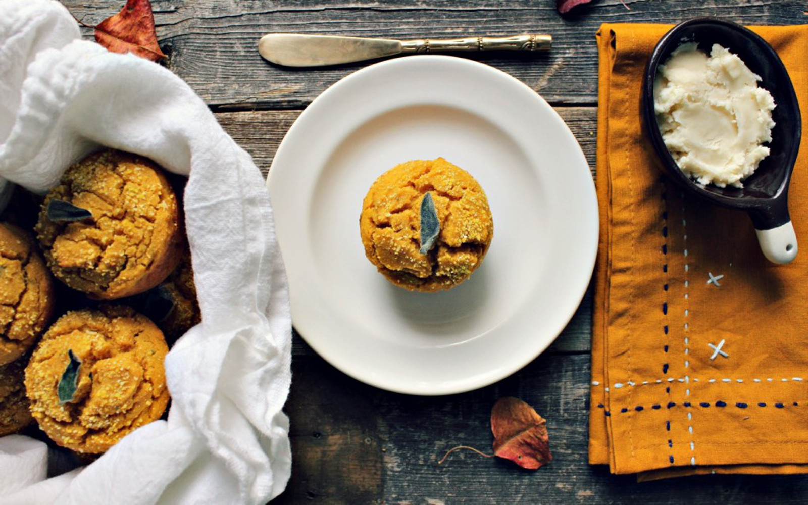 Vegan gluten-free Sweet Potato and Sage Corn Muffins topped with sage