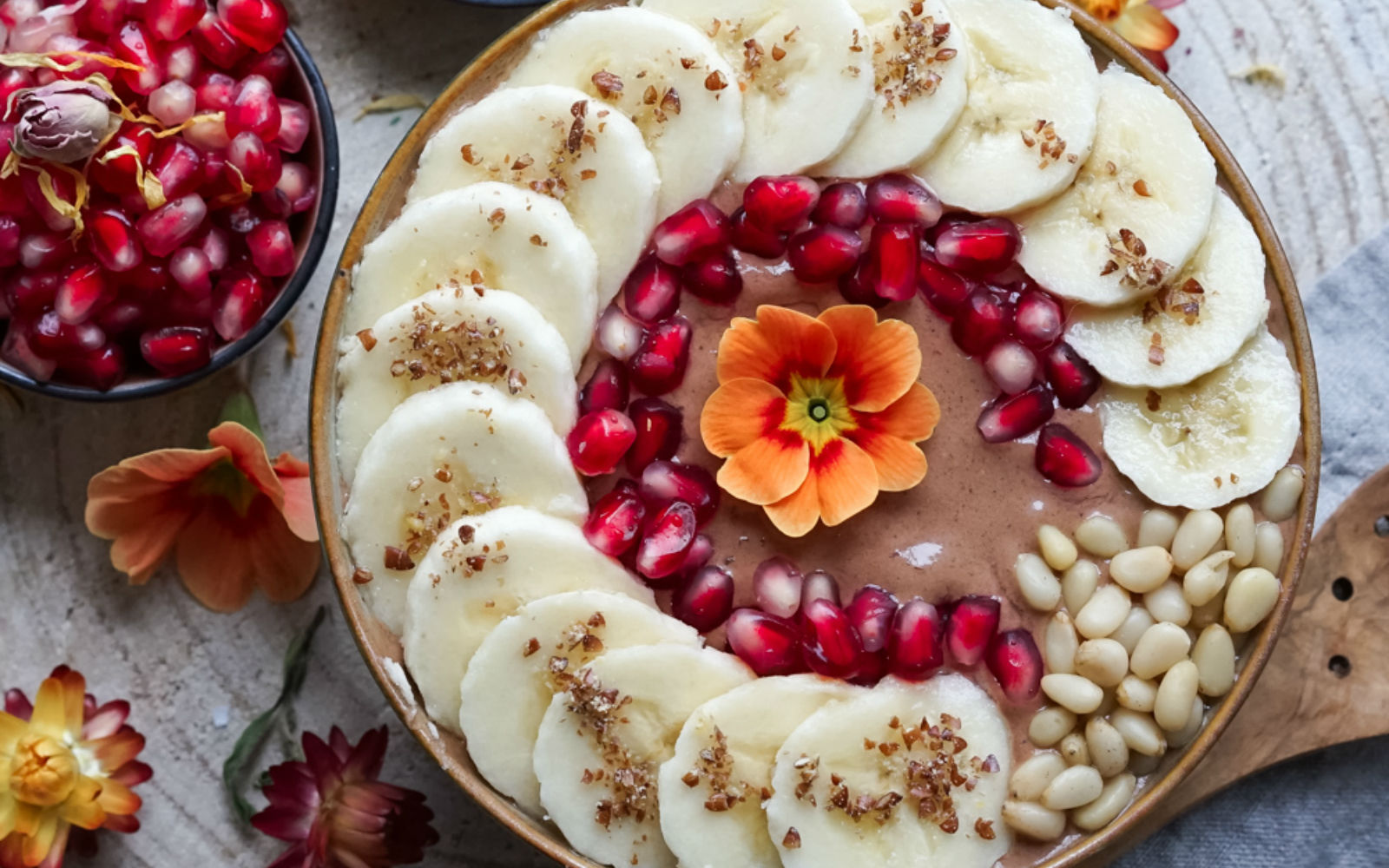 Vegan gluten-free Silken Tofu Chocolate Smoothie Bowl topped with fruit and a flower