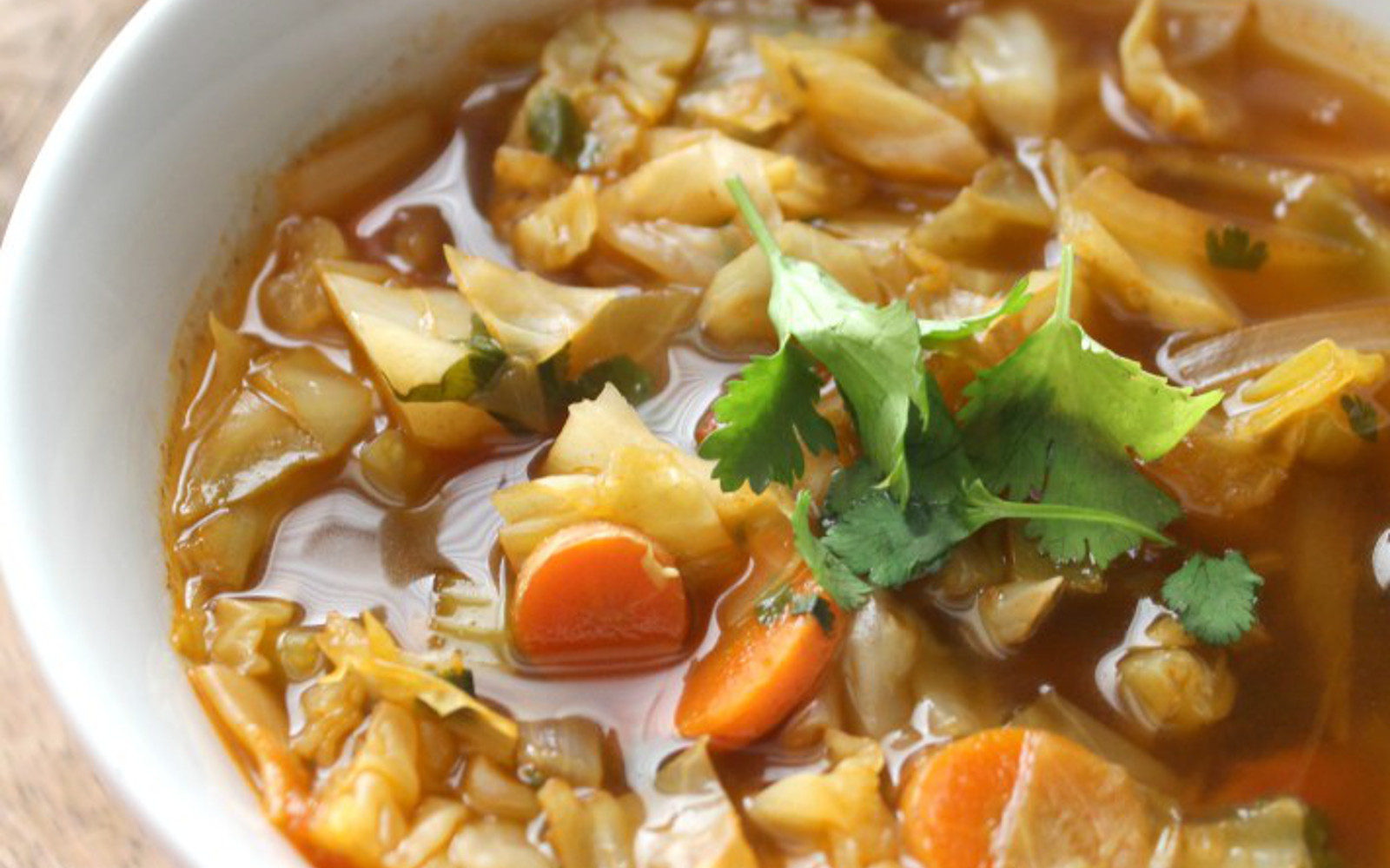 Vegan Gluten-Free Spicy Cabbage Detox Soup topped with parsley