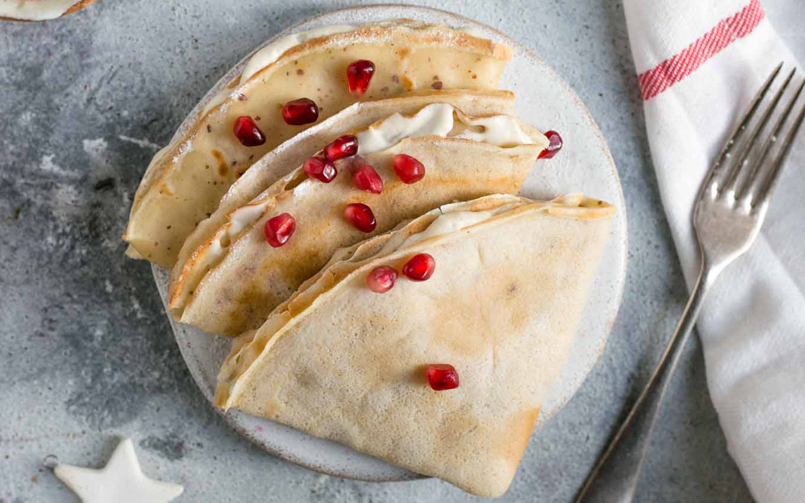 Vegan Classic French Crepes with pomegranate seeds with cashew cream