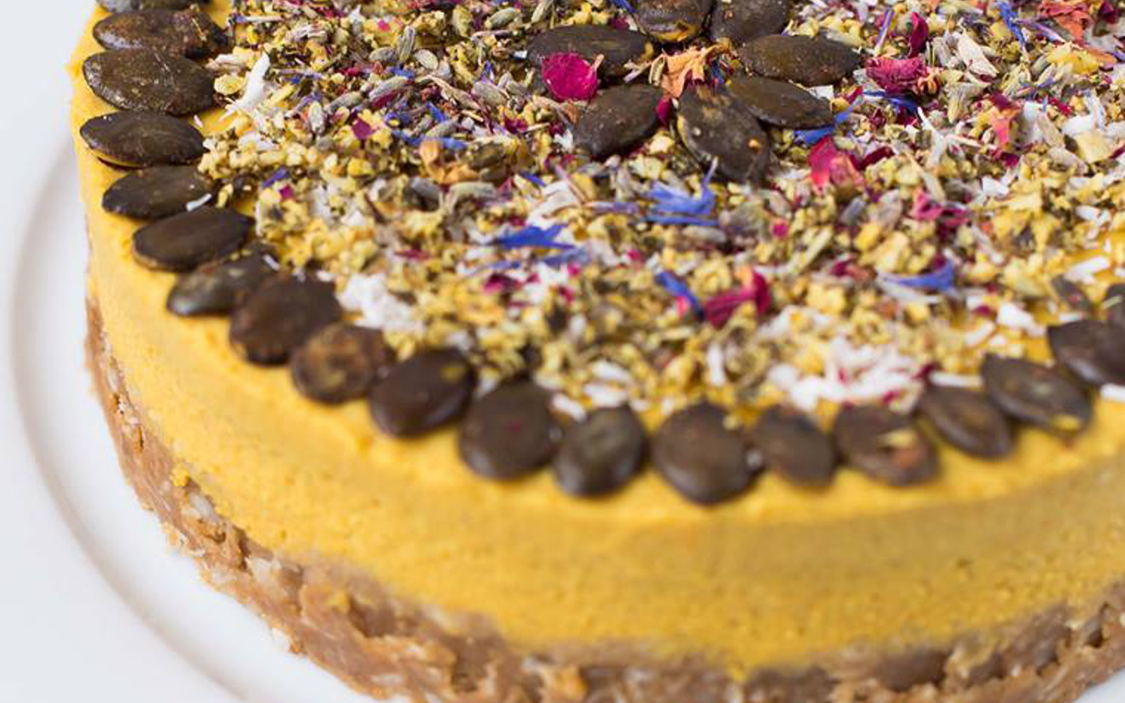 Vegan Golden Milk Pie with sweet potatoes with colorful toppings