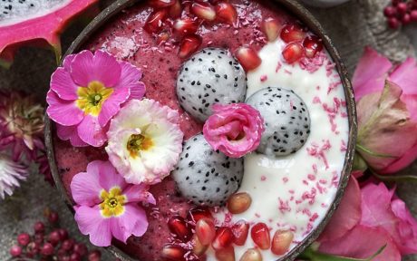Vegan Gluten-Free Pink Pitaya-Cauliflower Nice Cream with dragon fruit, flowers, and pomegranate seeds