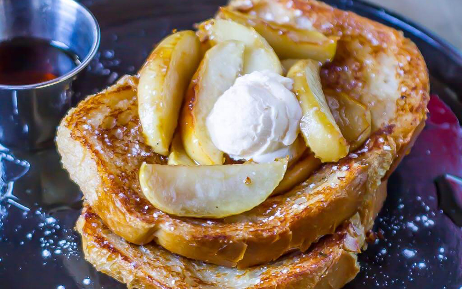 Vegan Cinnamon Apple French Toast with whipped cream and fresh fruit