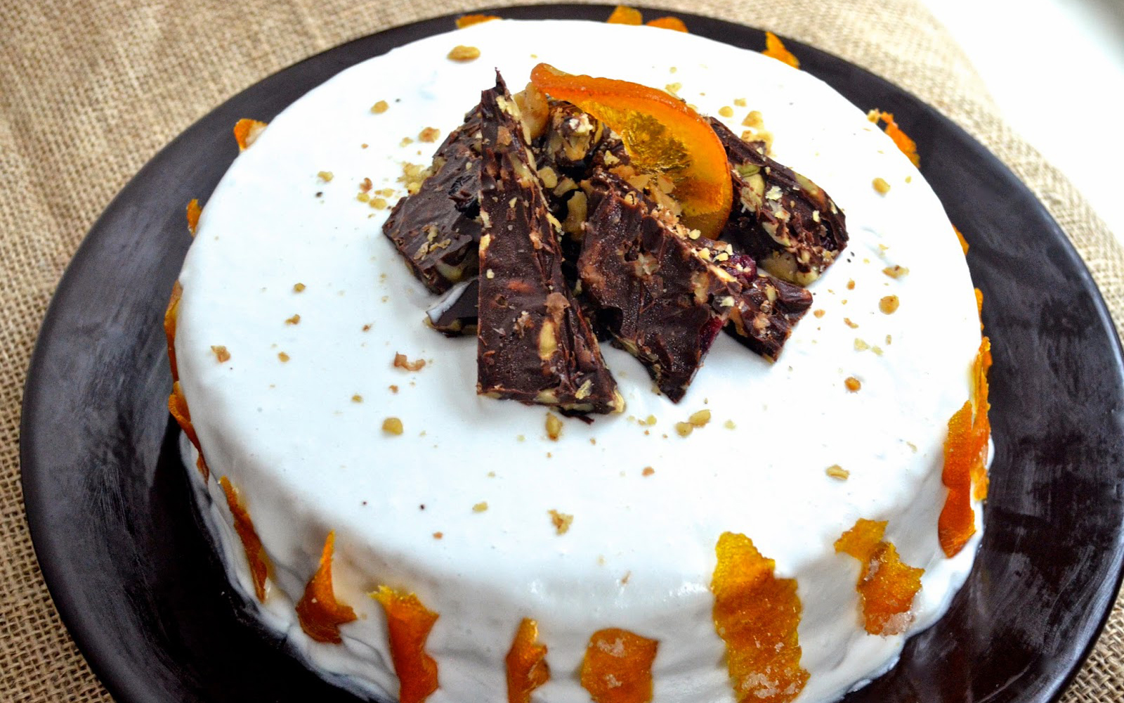 Vegan orange cream cake with candied orange peel