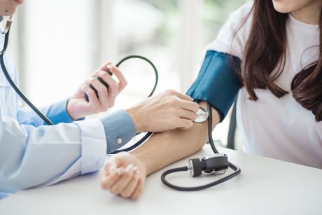 Doctor taking someone's blood pressure