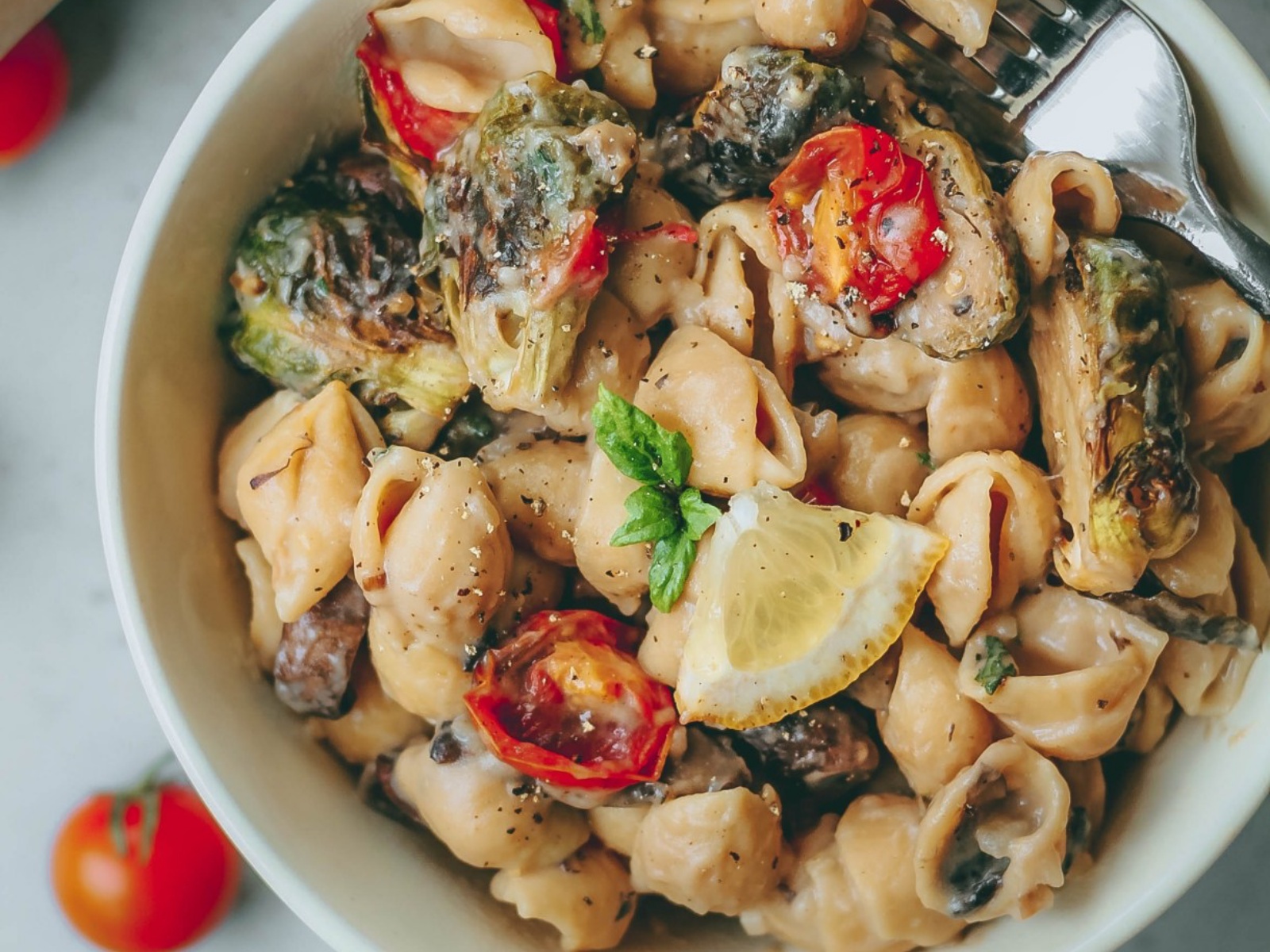 Vegan Creamy Garlic Pasta With Roasted Brussels Sprouts and Tomatoes