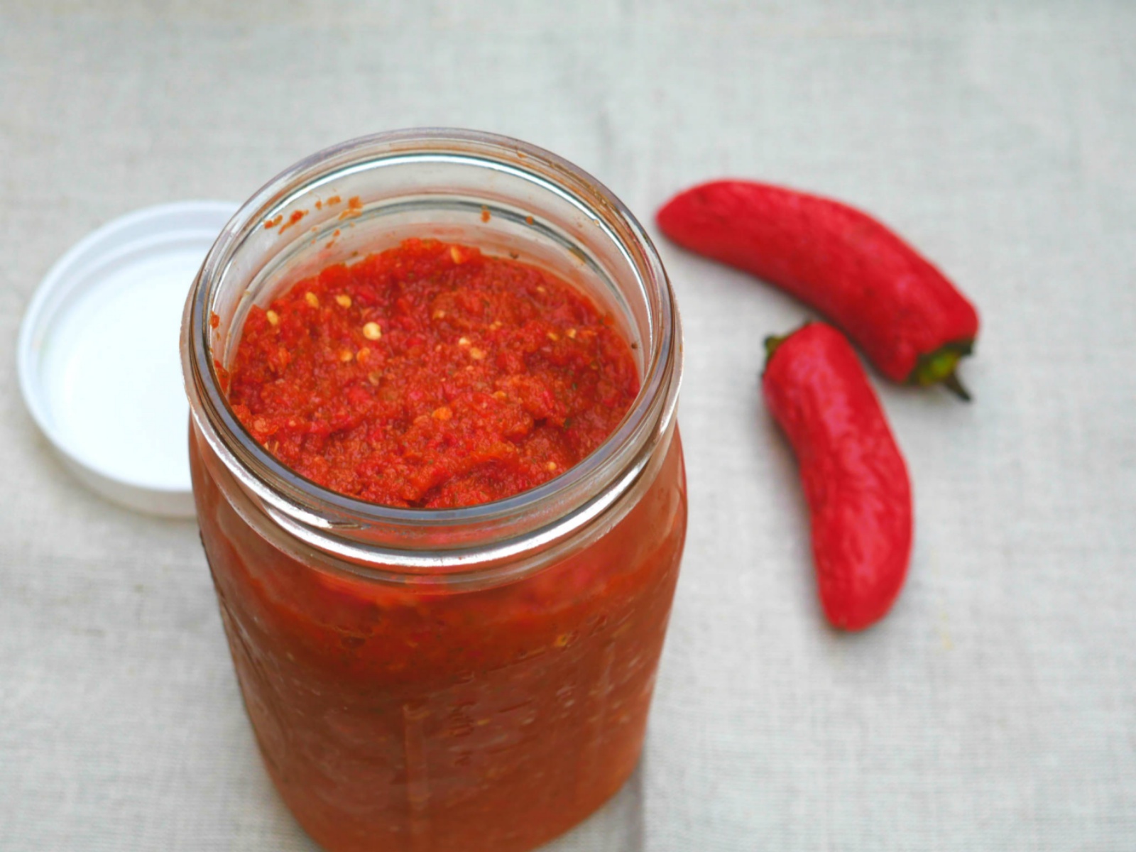 A bright red, spicy, flavorful hot sauce - raw and homemade