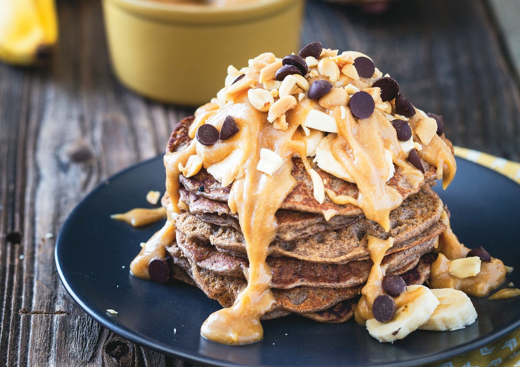 Buckwheat Banana Bread Pancakes with Peanut Butter Syrup 