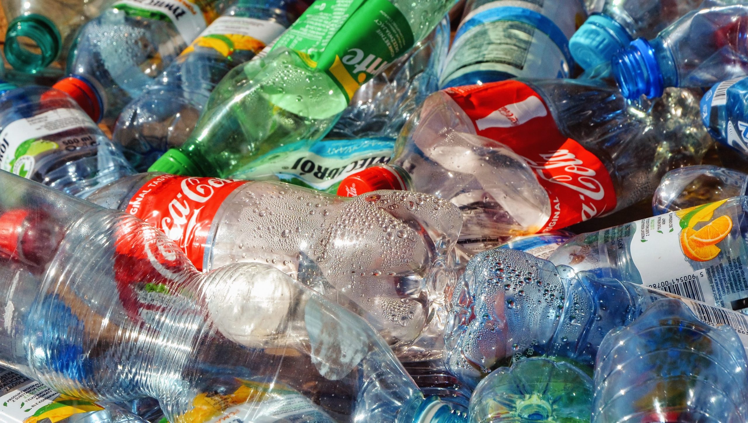 Warsaw, Poland - August 23 2019: a pile of empty, used plastic beverage bottles. Bottles prepared for recycling. Plastic in recyclable waste. Recycle business. Ecologic garbage recycle management