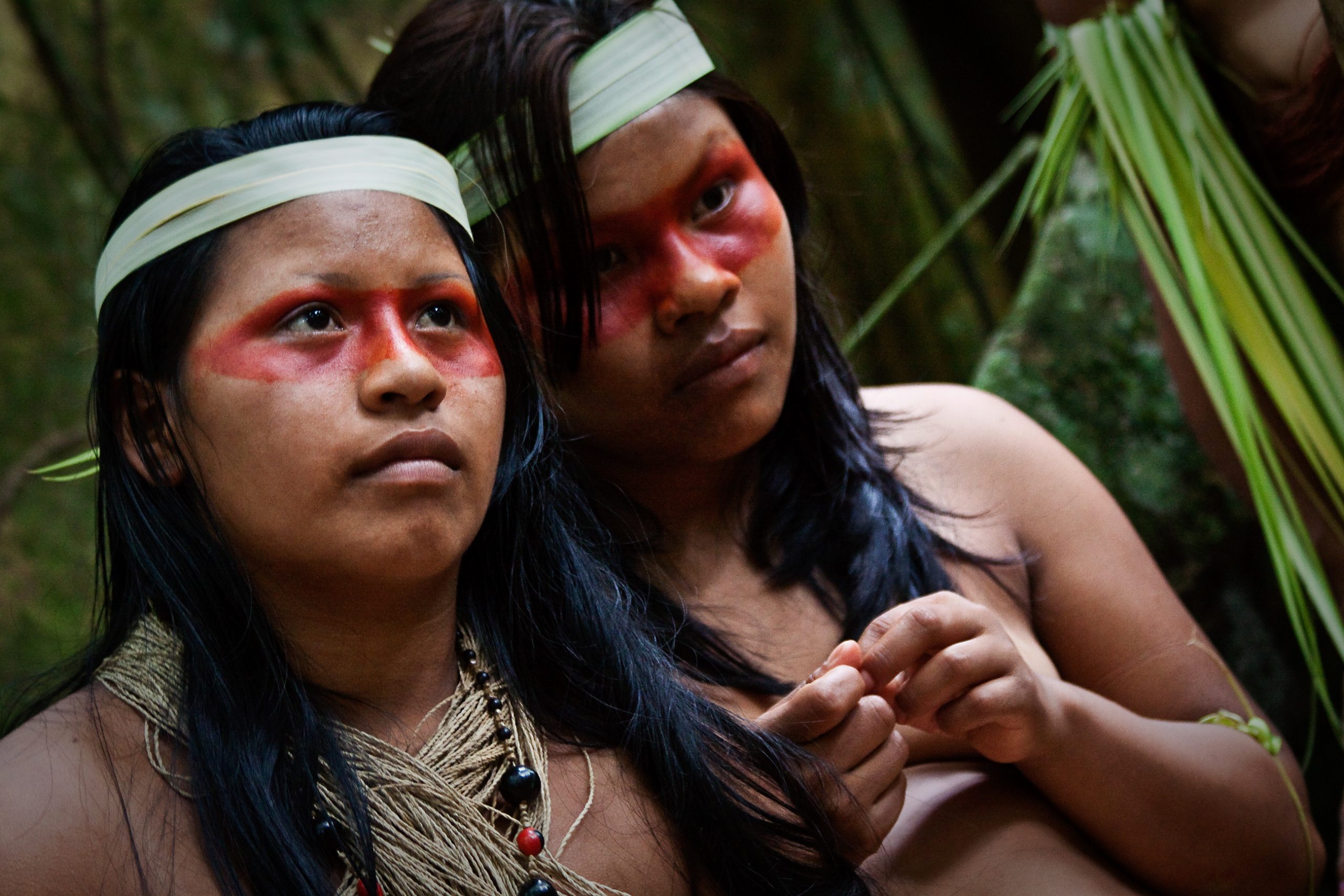 ORELLANA, ECUADOR - AUGUST 10, 2012: Two young girls form huaorani tribe in the amazon rainforest, Yasuni National Park, Ecuador