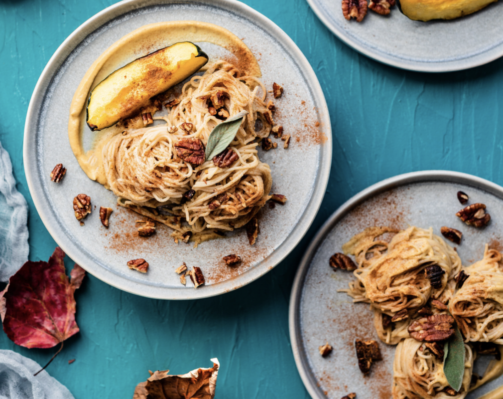 Vegan roasted acorn squash, sage and pecan sauce with rice noodles