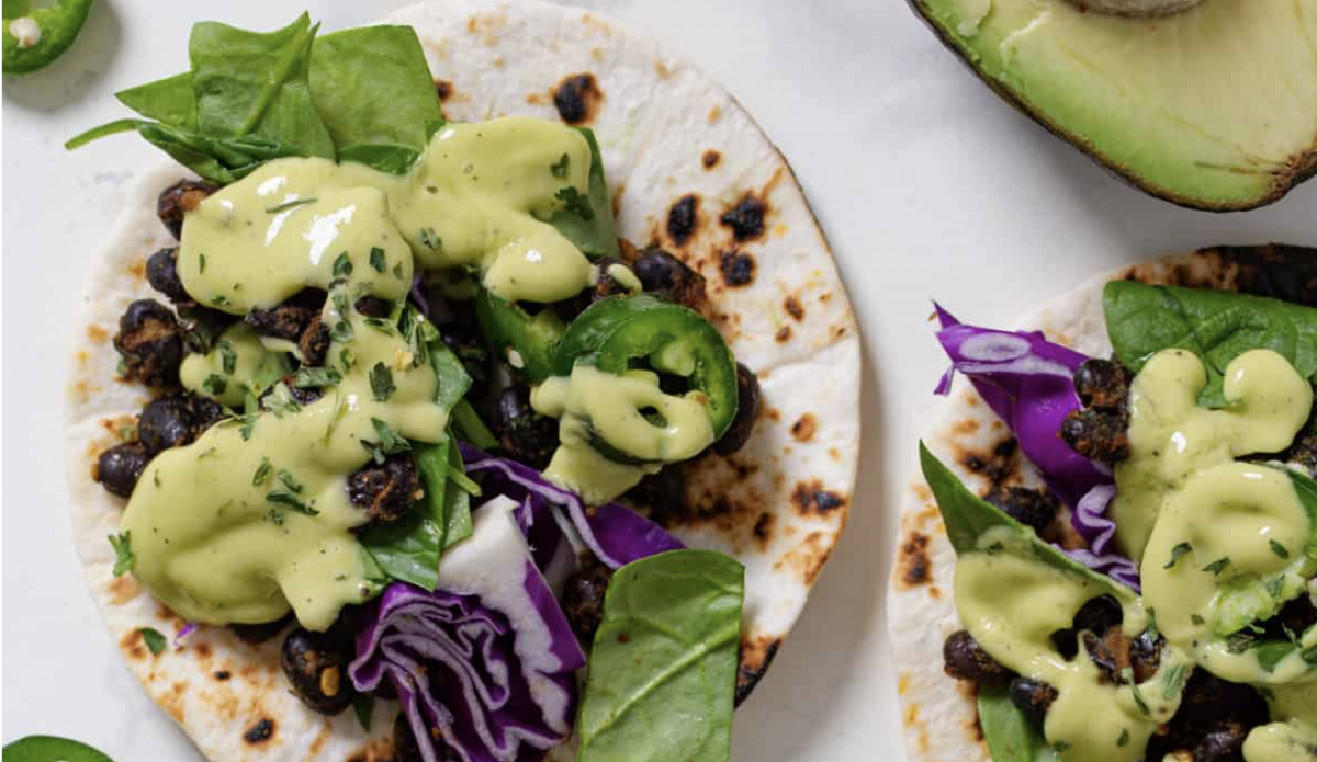 Vegan tacos with black beans and avocado dressing