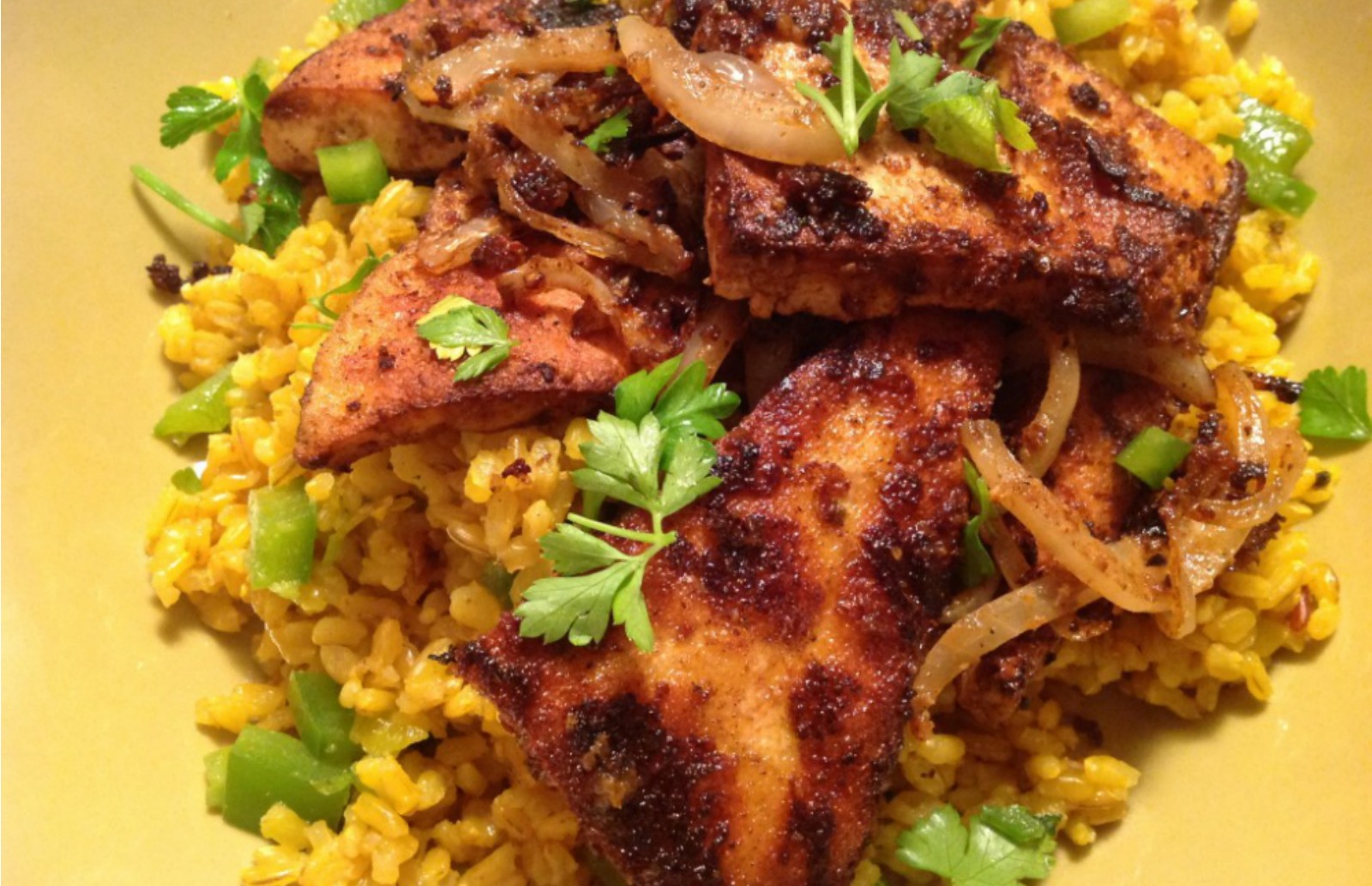 Chile-Rubbed Tofu and Onions Over Spanish Rice