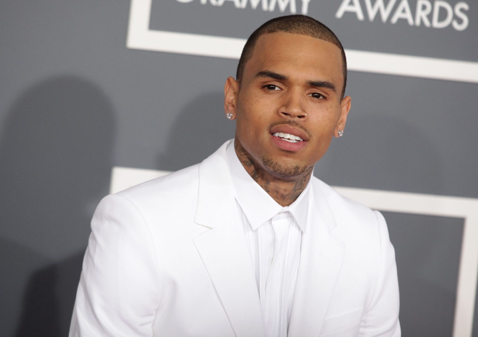 Chris Brown in a white tux on the red carpet