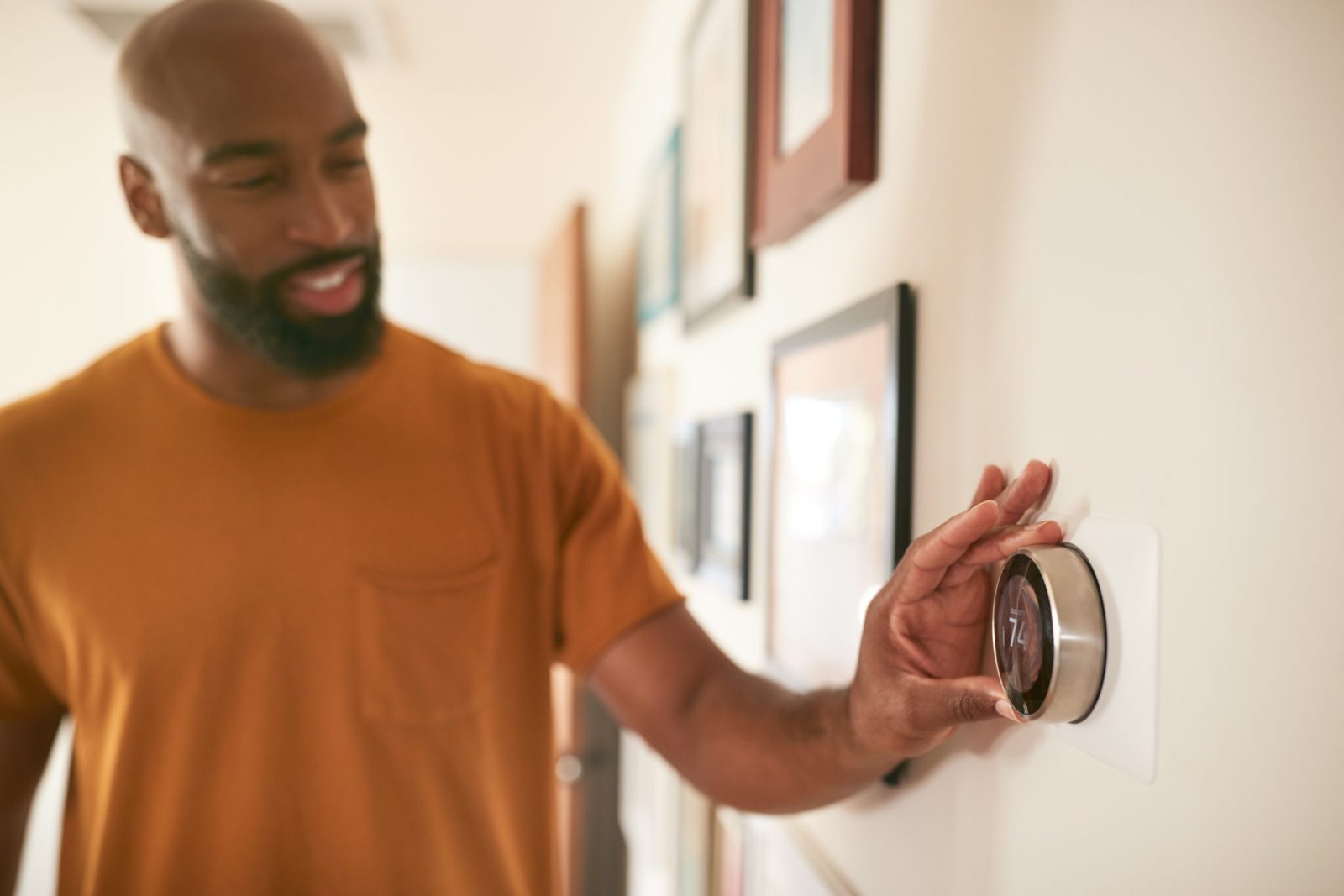 Man changing house thermostat