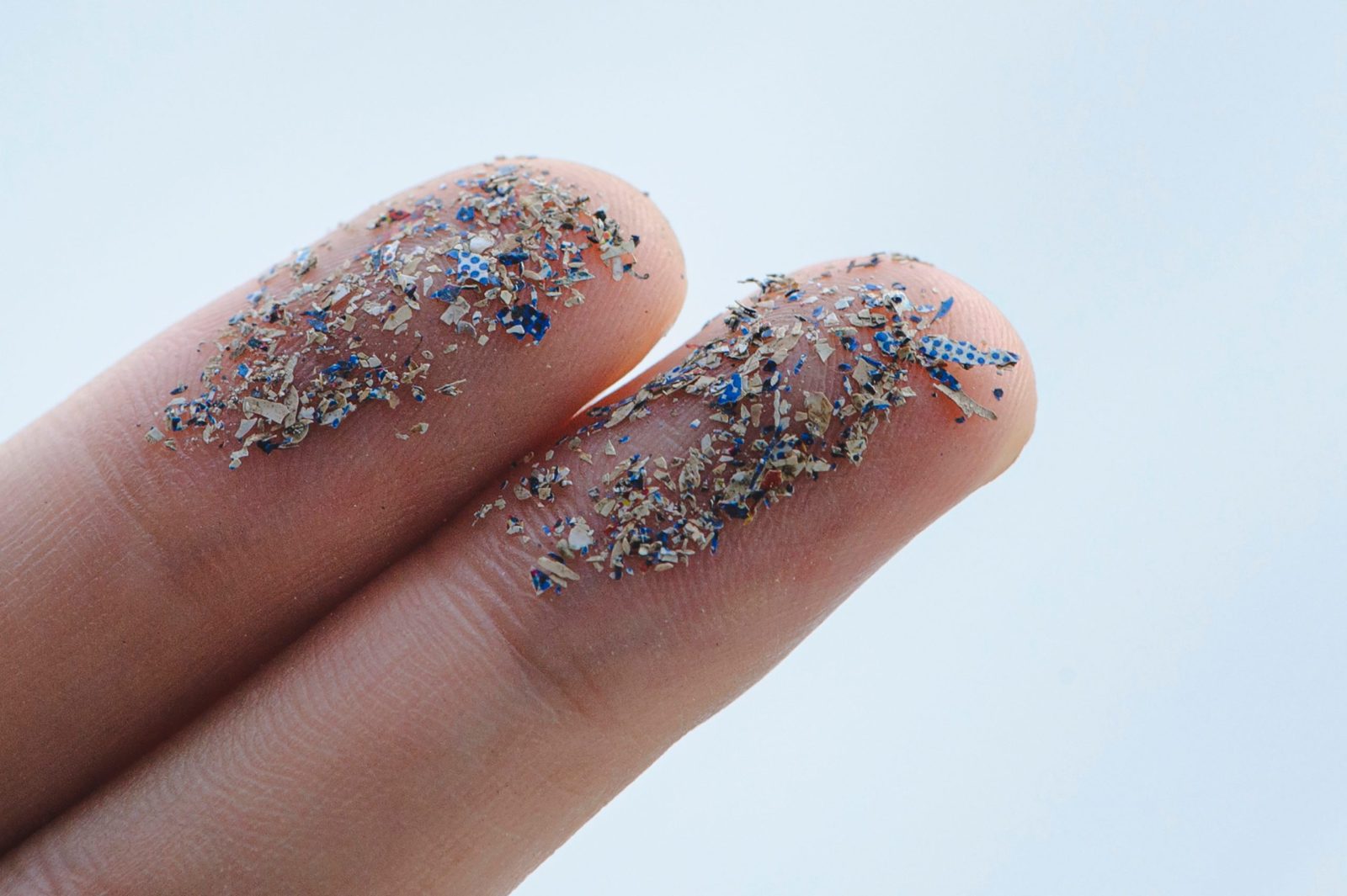 Microplastics on someones fingers