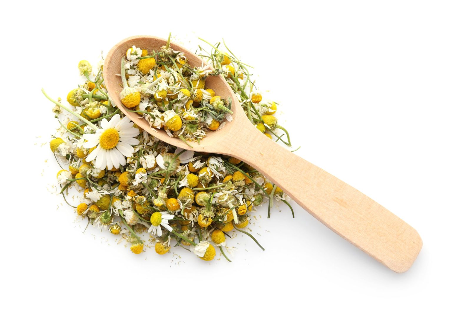 Dried chamomile tea with a wooden spoon