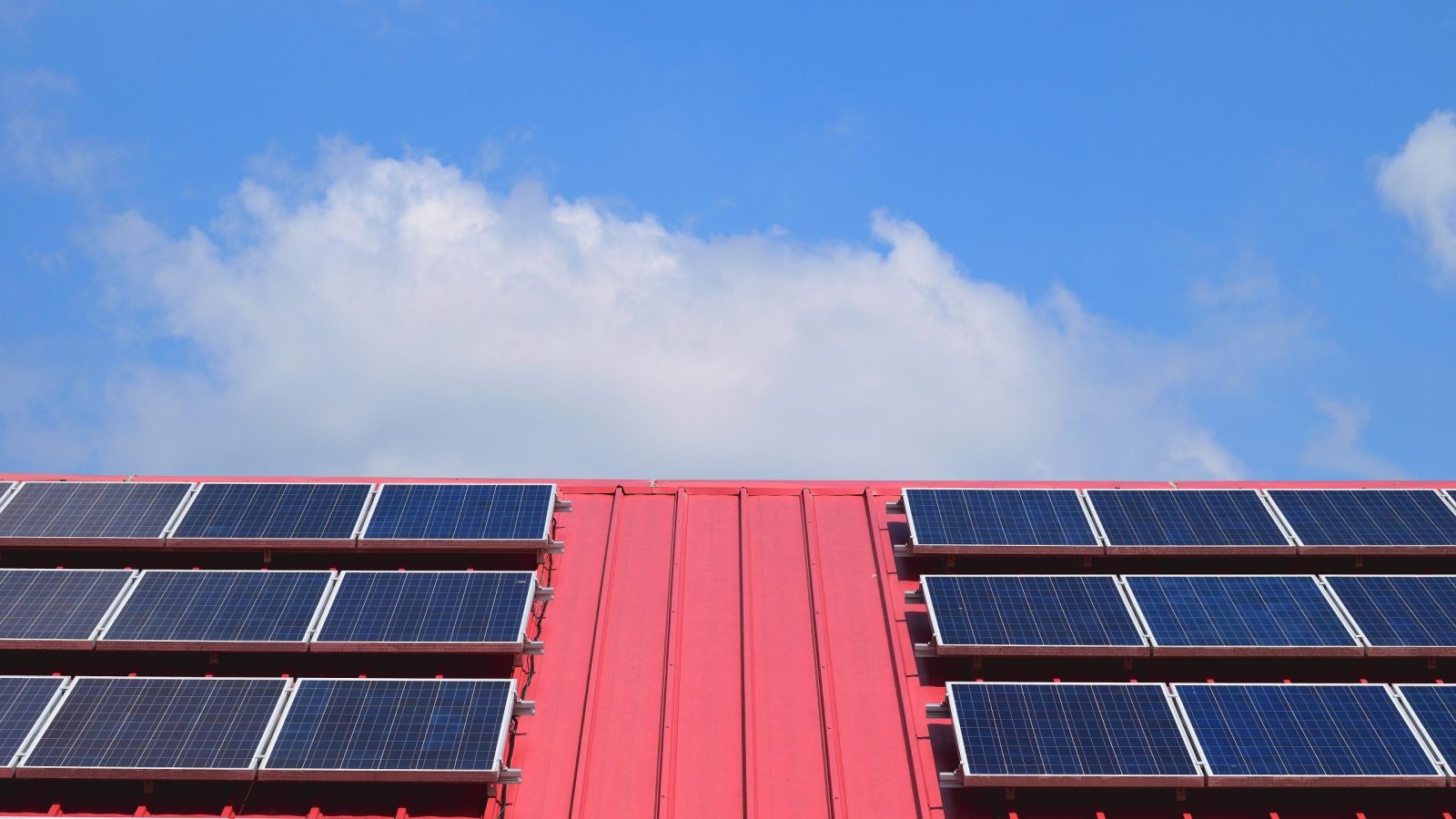 solar panels on top of a red roof
