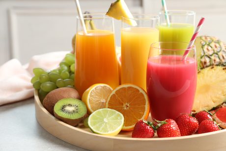 fruit juices and fruit on platter