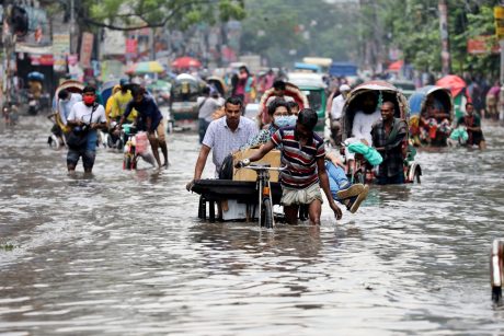 People driving through floods in India